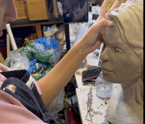 Lara Working on Portrait Sculpture